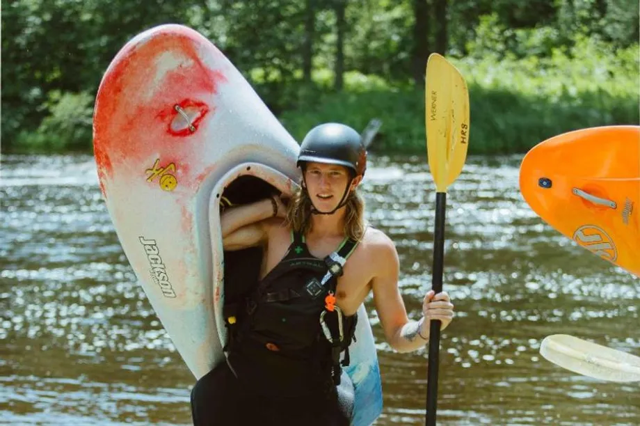 vanguard duncan holds his kayaking gear