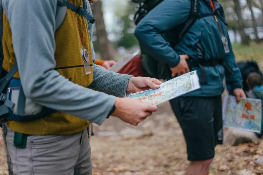 Student looking at map Our People Variant