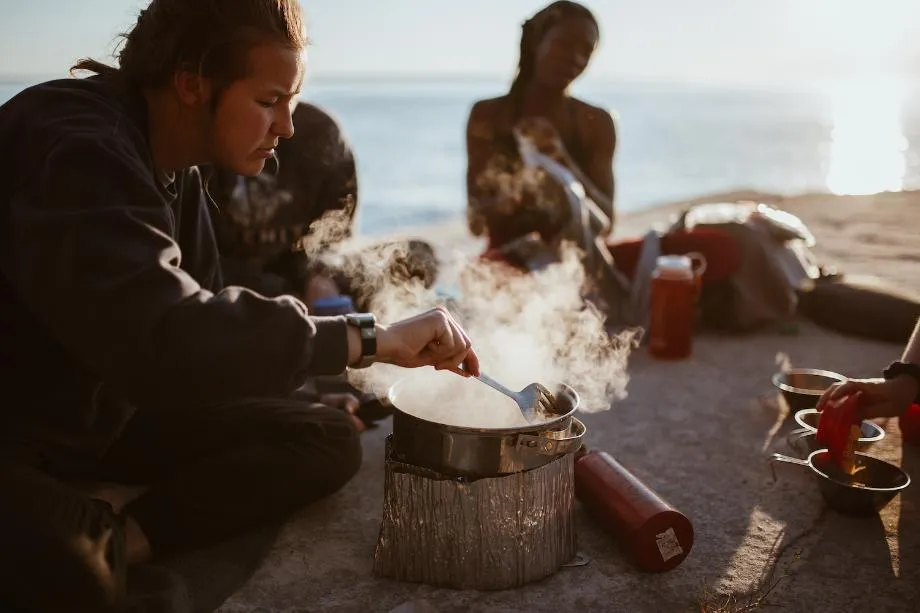 Students cooking dinner at Lake Superior Our People Variant