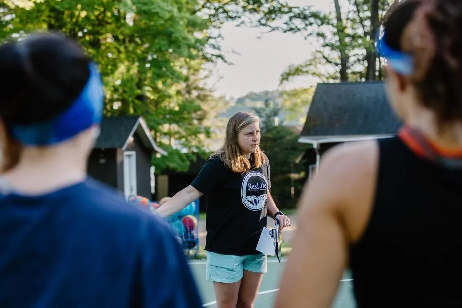 A lady talking to campers