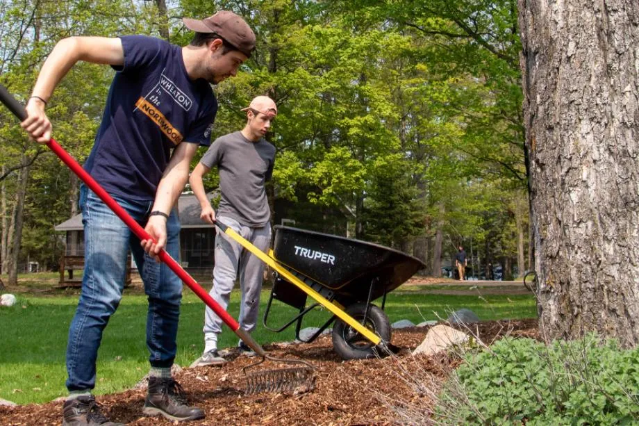 Two men raking