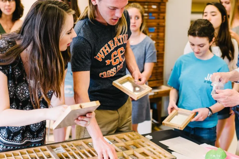 students working with moveable type
