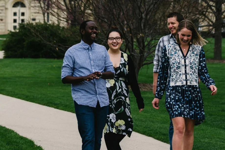 Wheaton College Graduate School Students walking on path on blanchard lawn