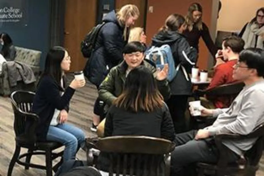 People talking at graduate school student lounge