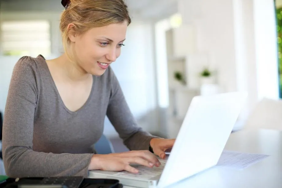woman sitting at a laptop
