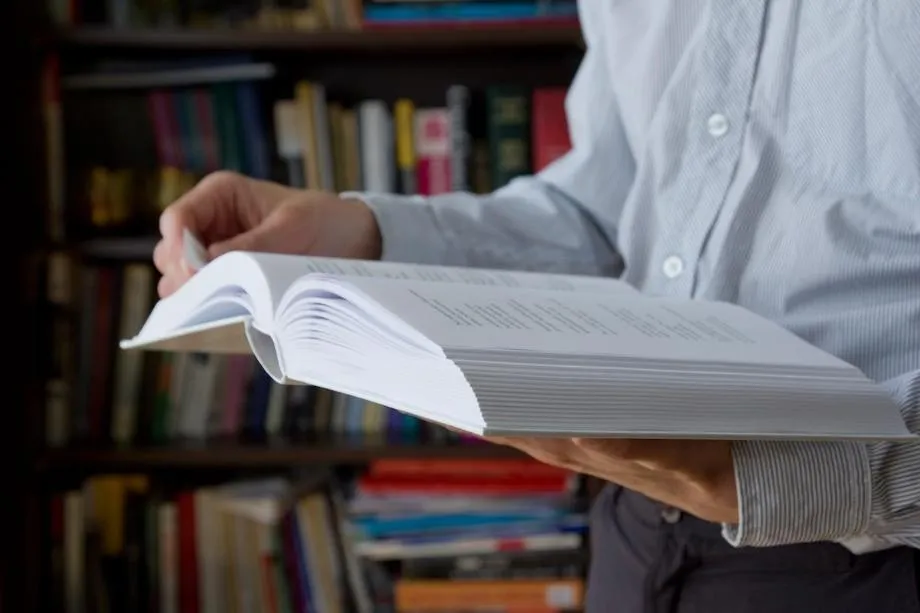 hands holding a book