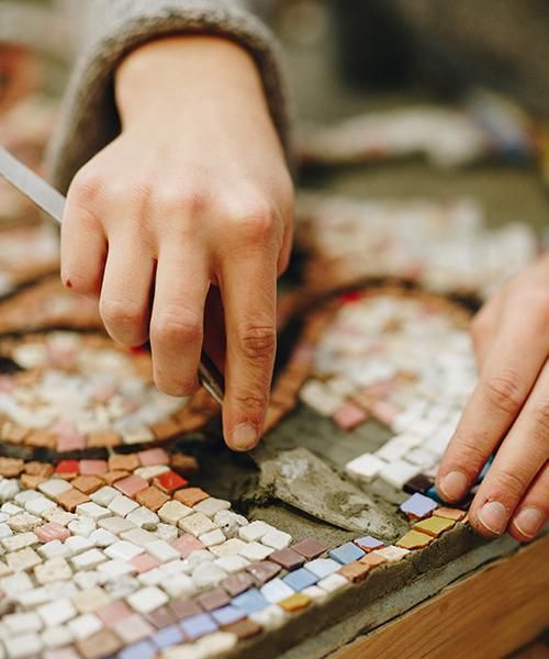 Close-up of the process of crafting a mosaic