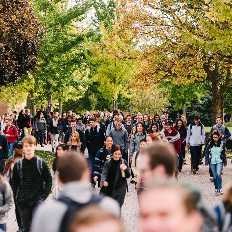 students walking outside in the fall 760x760