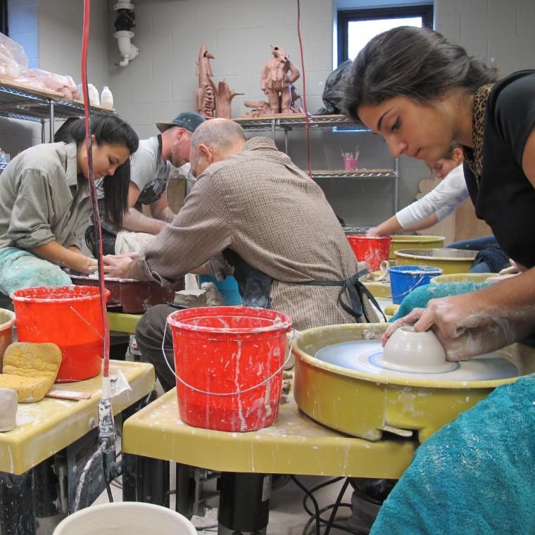 People working with ceramics