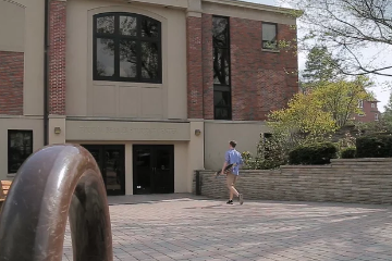 Student Walking into Todd M. Beamer Student Center at Wheaton College