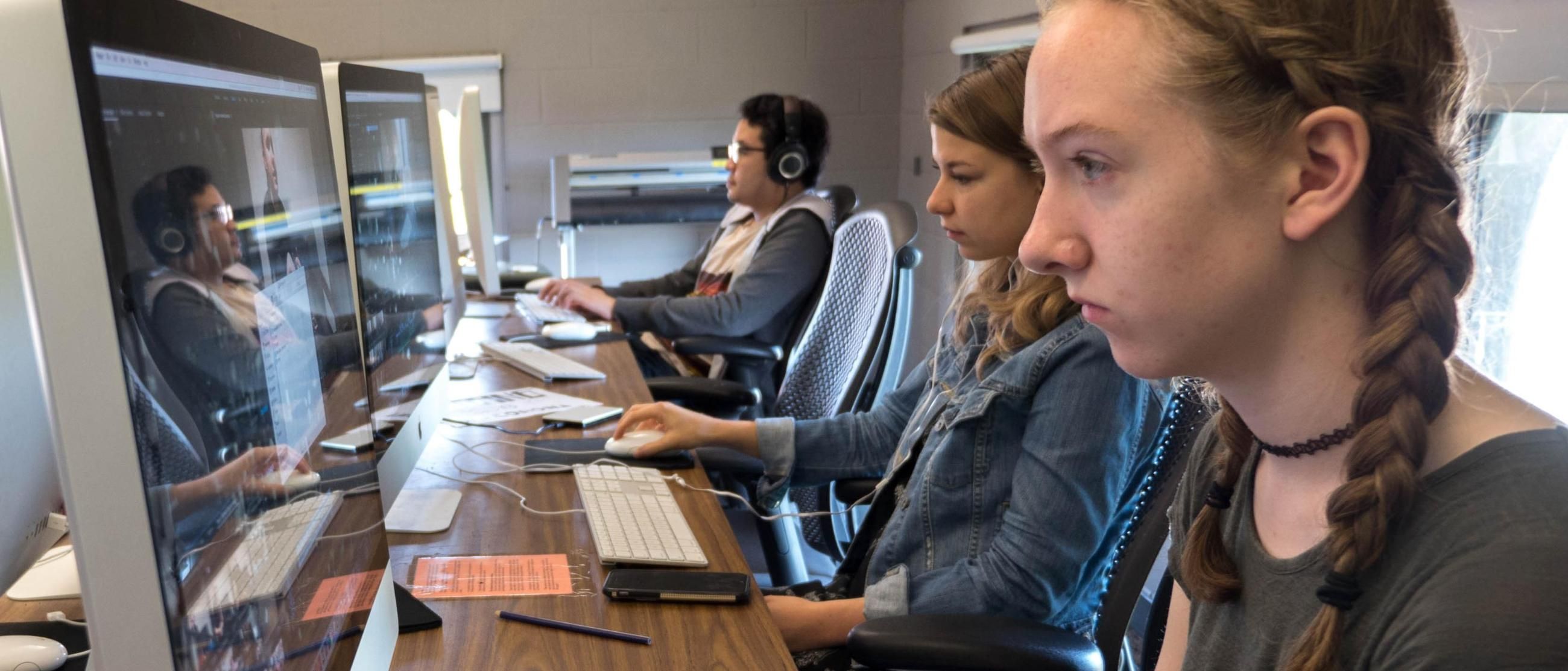 Two students in the Media Lab Communications Department at Wheaton College IL