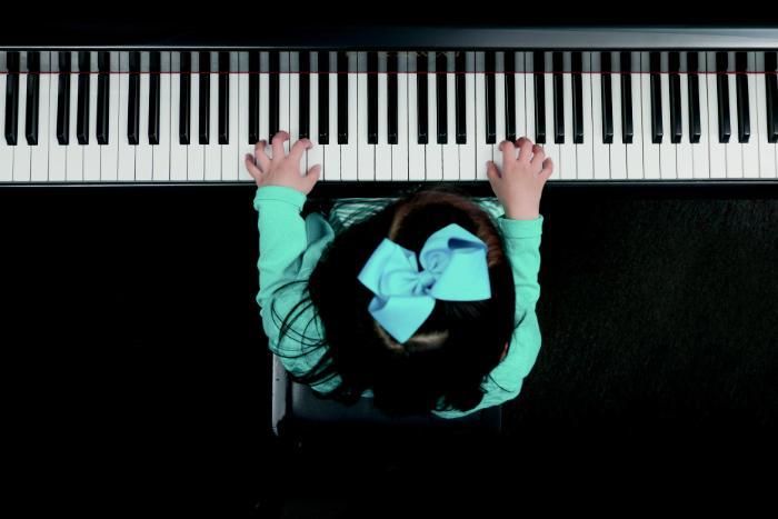 Young child playing the piano