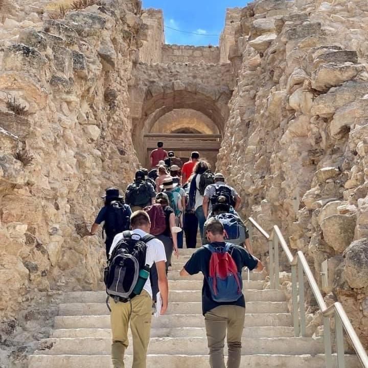 Students climbing the steps on a field excursion to Herodium.