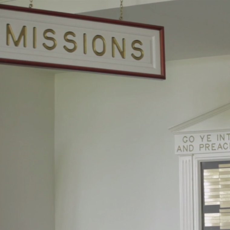 A sign with the word Missions written on it