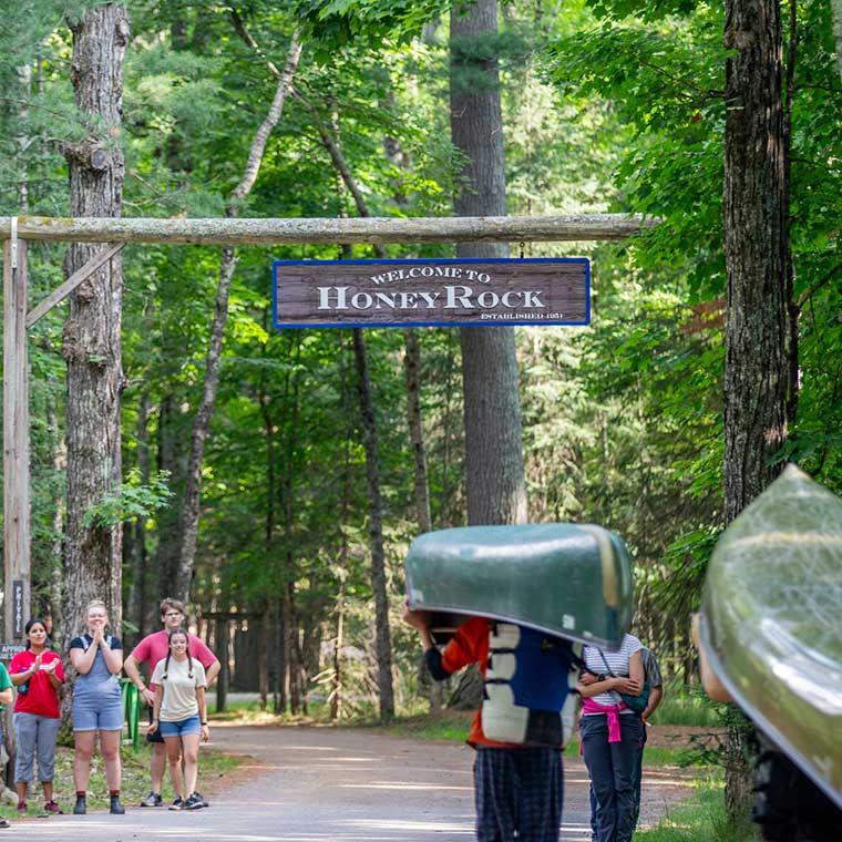 People taking canoes back to camp