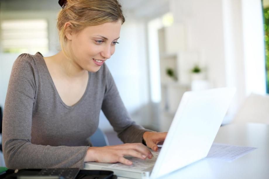 woman sitting at a laptop
