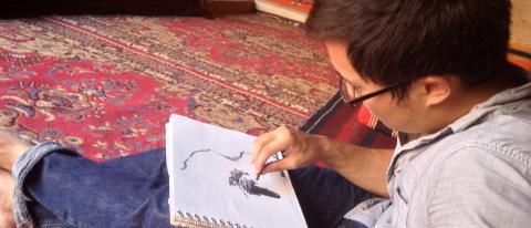 man sketching