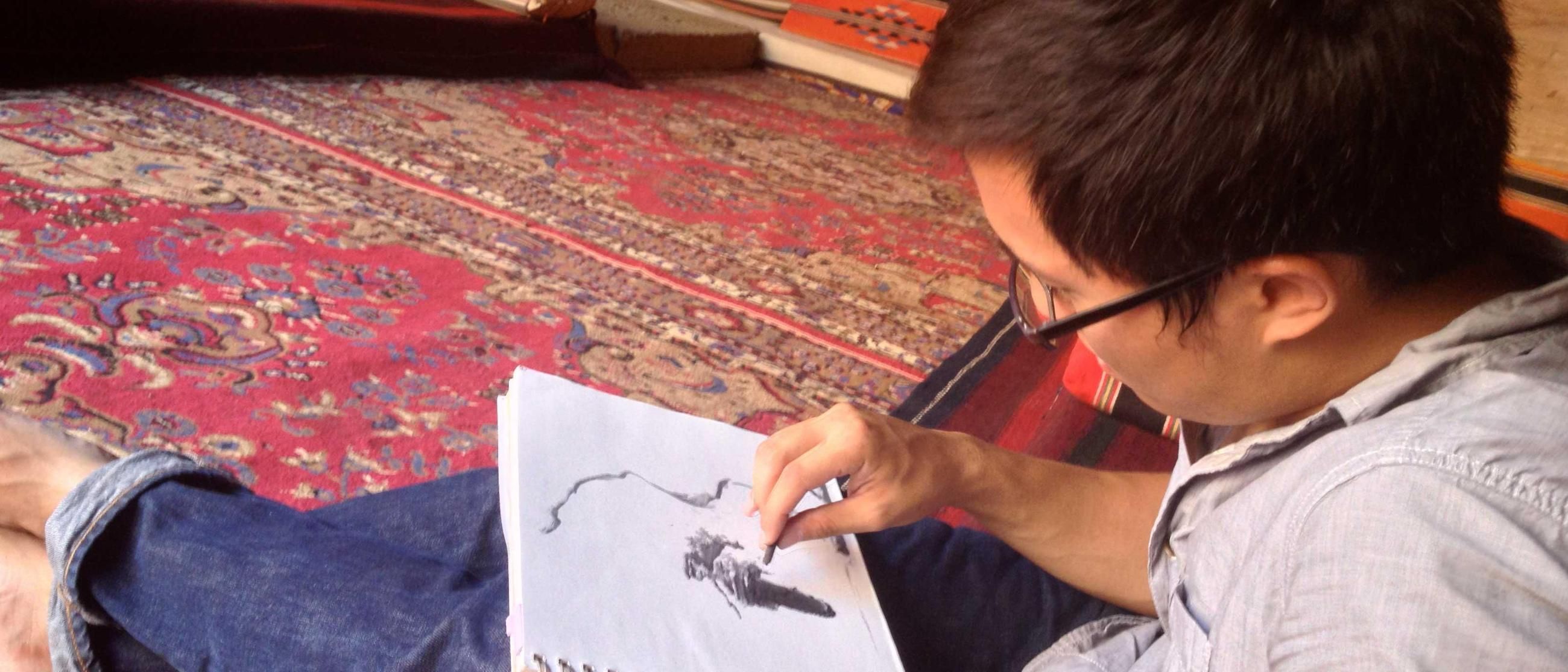 man sketching