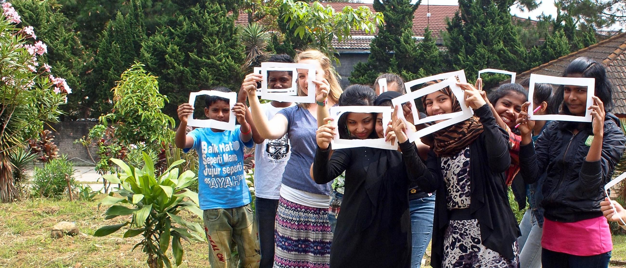 HNGR student with children and signs
