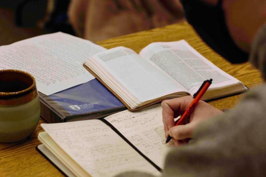 student writing in a journal
