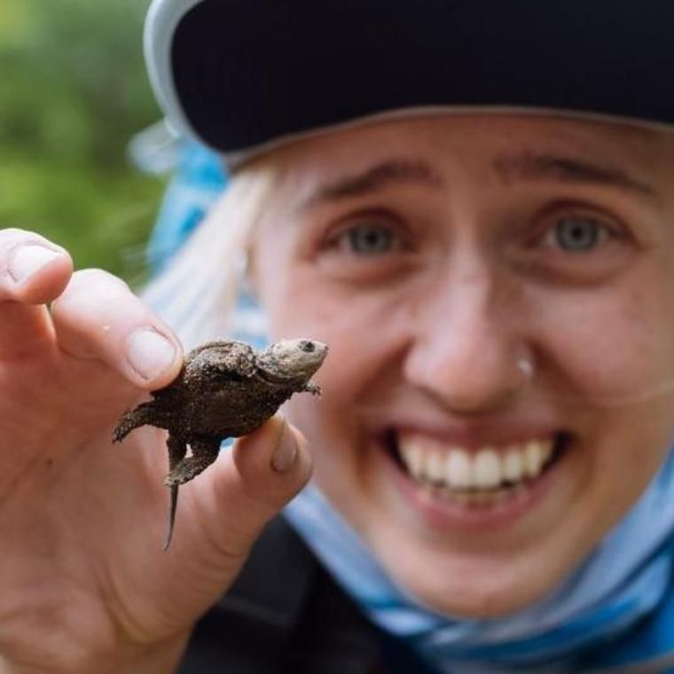 olivia cassel holds a turtle