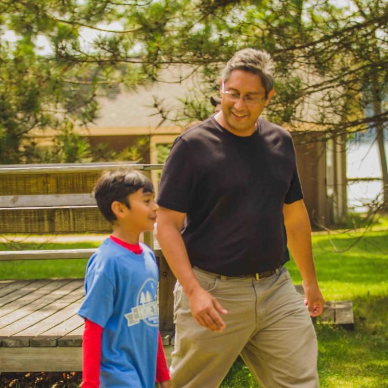 father and son walking and talking at honeyrock