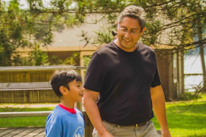 father and son walking and talking at honeyrock