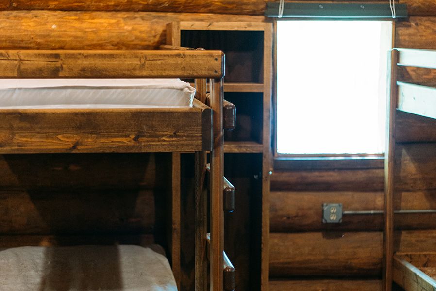 Every camper has their own cubby space near their bunk bed to keep their belongings.