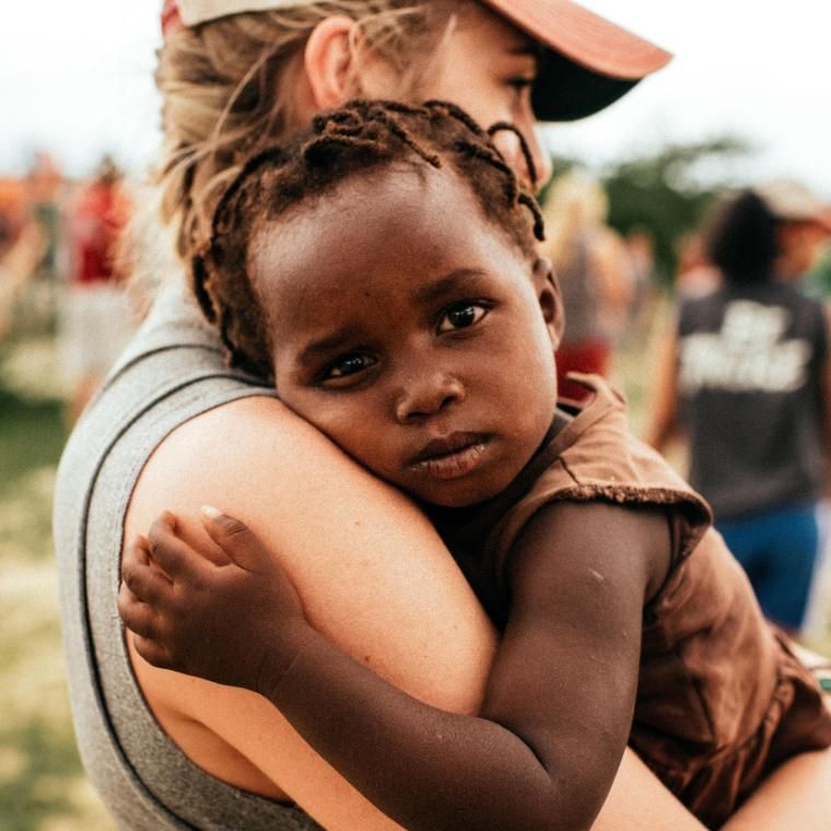 Student holding child