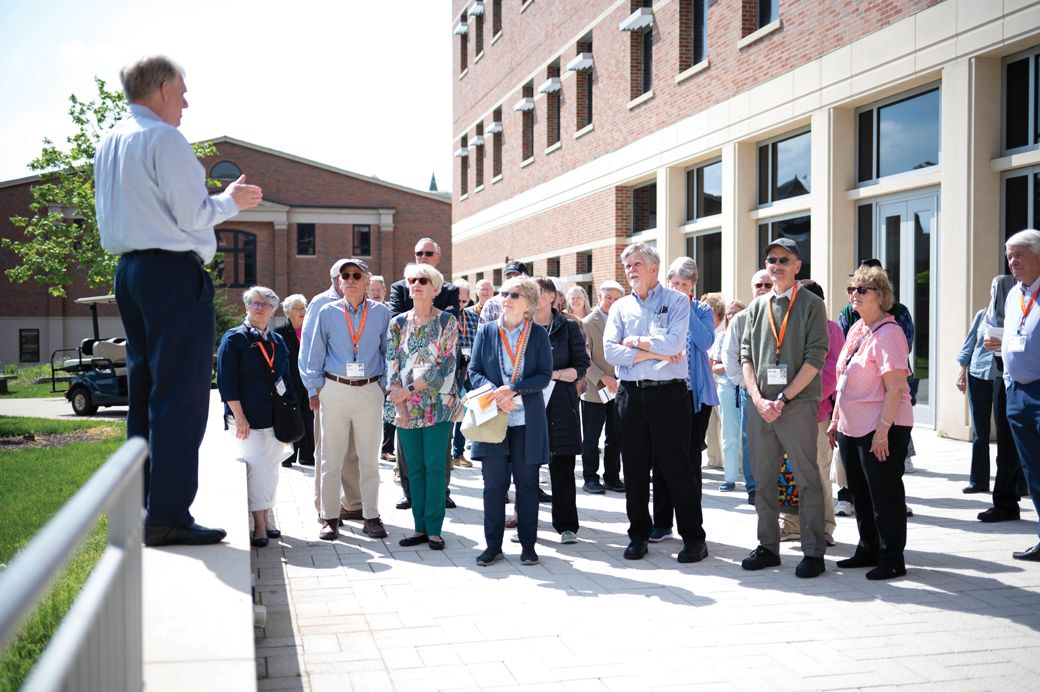 Retired Wheaton College architect Bruce Koenigsberg leads the Class of 1973 on a tour of campus