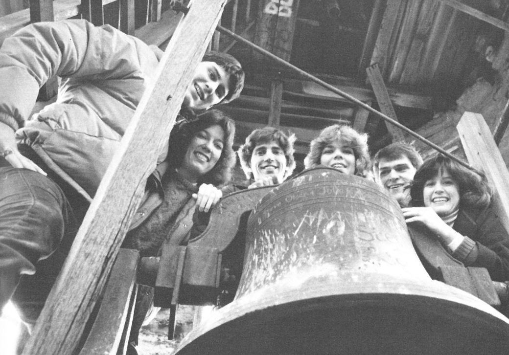 A group of students and guests ring the Blanchard Bell.