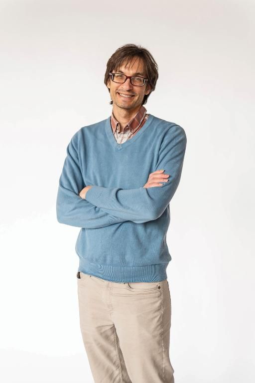 Wheaton College psychology doctoral candidate Thomas Douce in a blue sweater