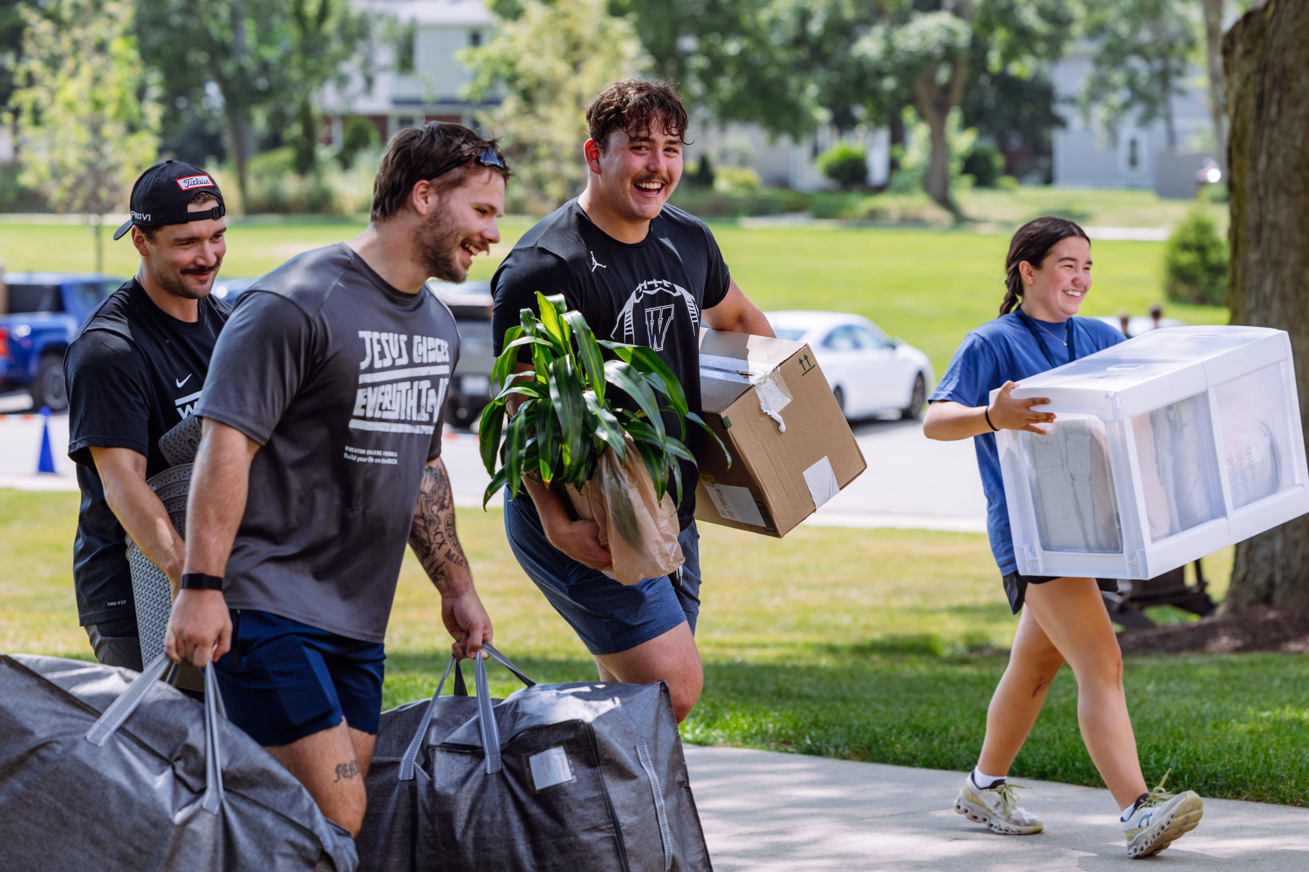 Friends and family help freshmen move into the dorms.