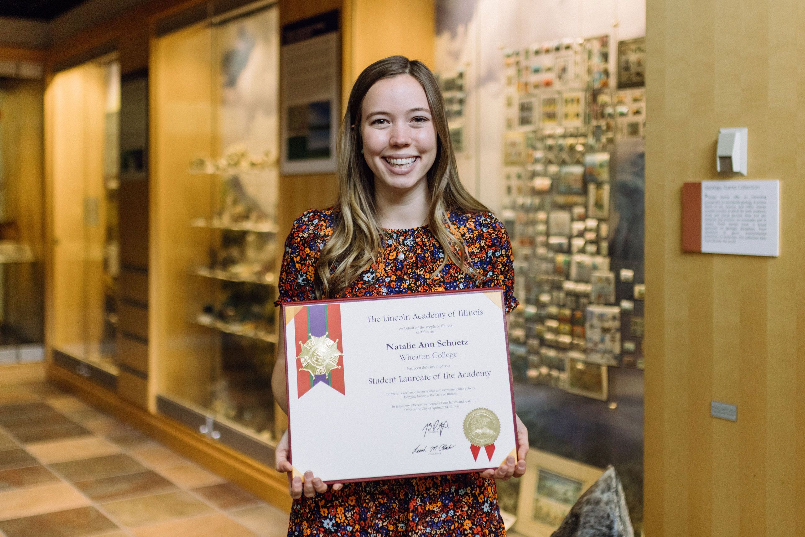 Wheaton College senior Natalie Schuetz with her Student Laureate award from the Lincoln Academy of Illinois.