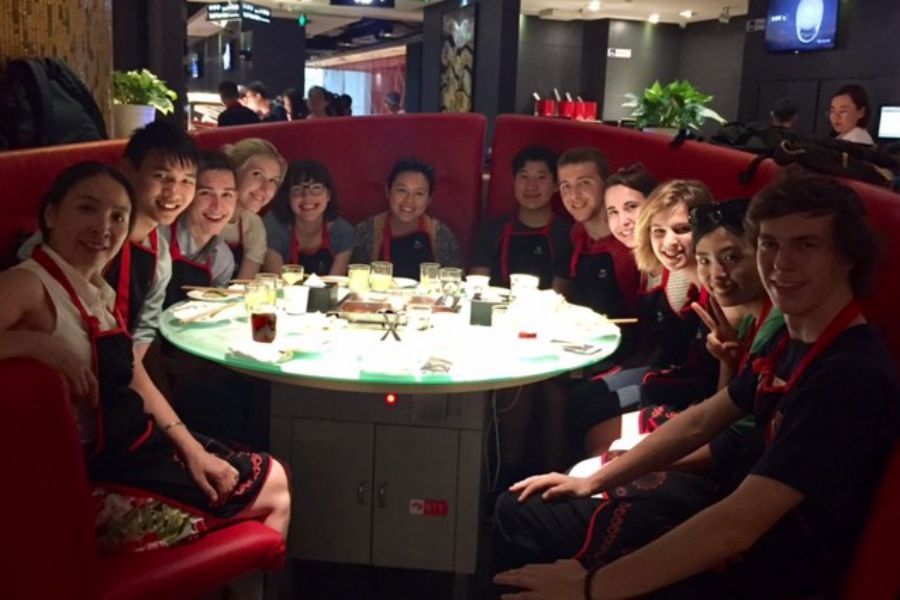 Wheaton in China students enjoying a hotpot meal together