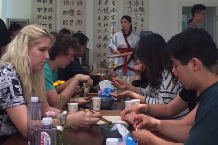 Wheaton in China students making dumplings