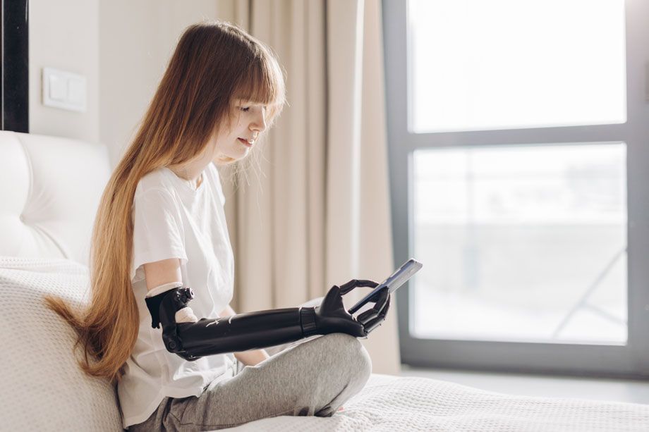 Girl with Robotic Arm Texting