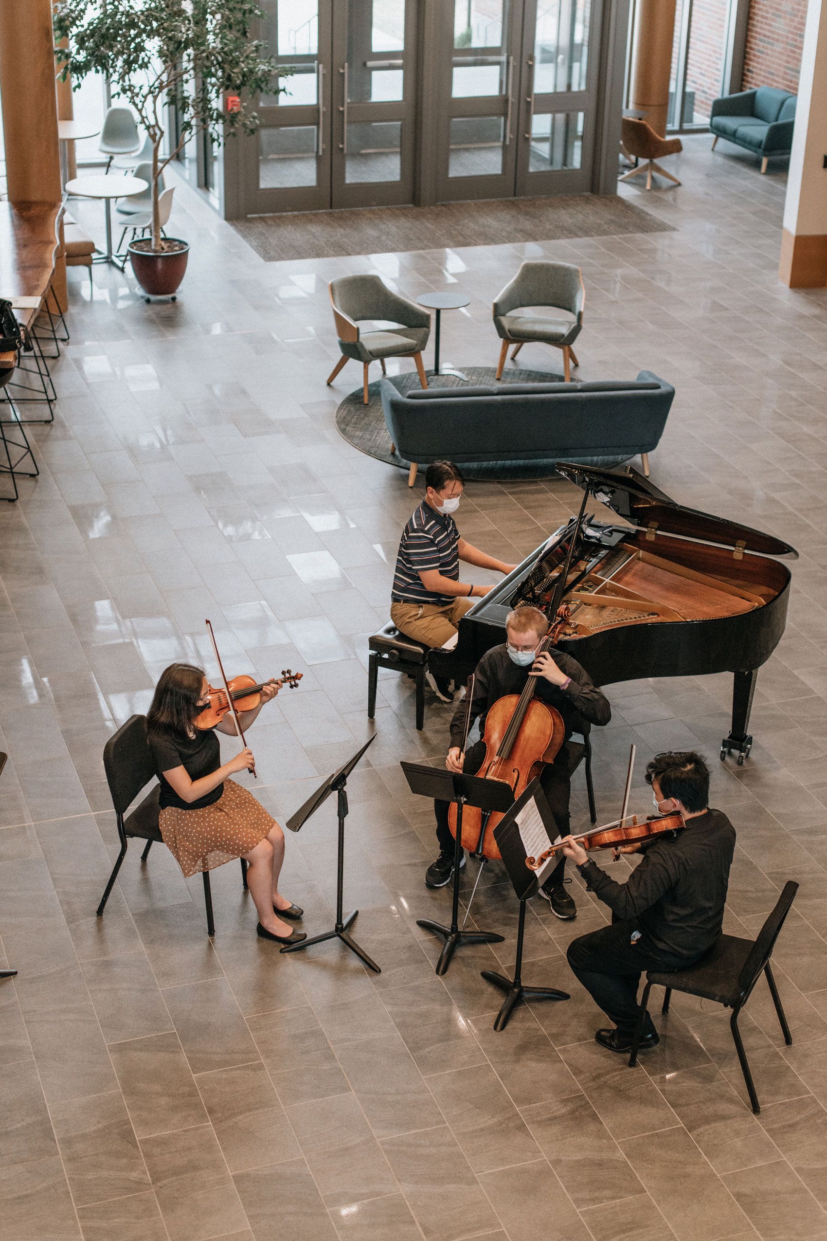 Wheaton College Summer Institute student quartet playing in Armerding Center for Music and the Arts Atrium