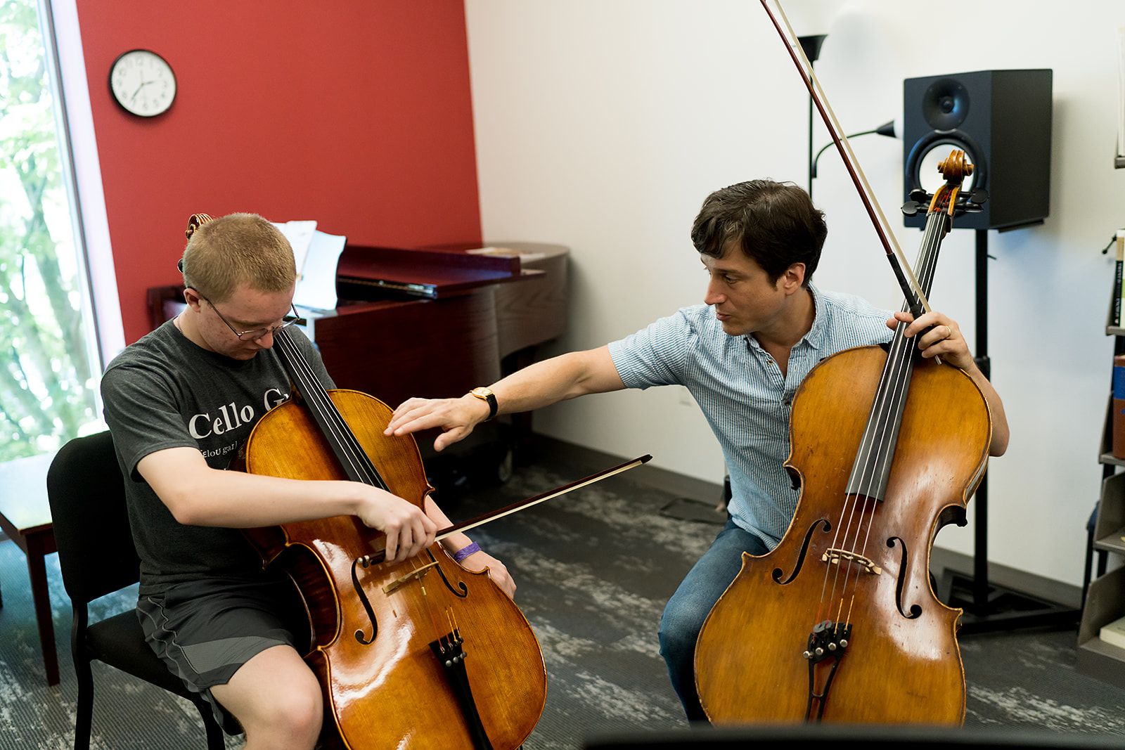 Wheaton College Summer Institute student and prof practicing cello