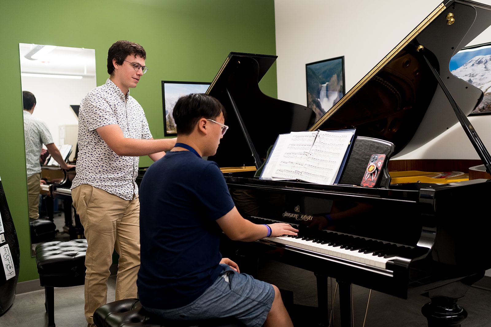Wheaton College Summer Institute student and prof playing piano