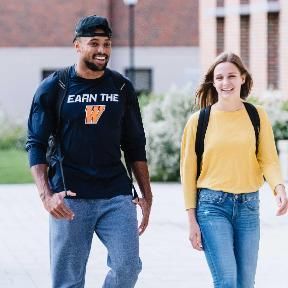 Two Students Walking Outside