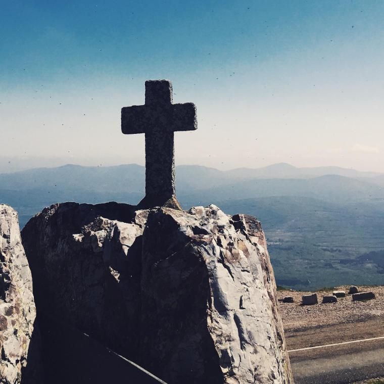  cross on top of rocky hill