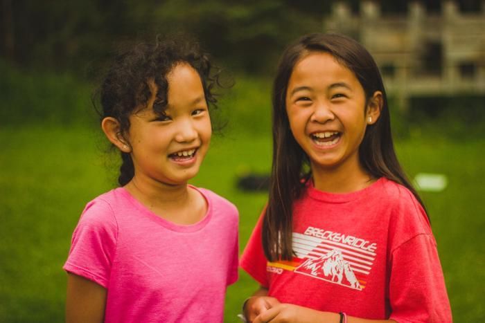 camper girls smiling at HoneyRock in Three Lakes, WI