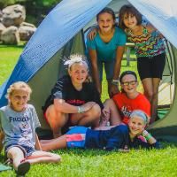 girls in a tent at honeyrock