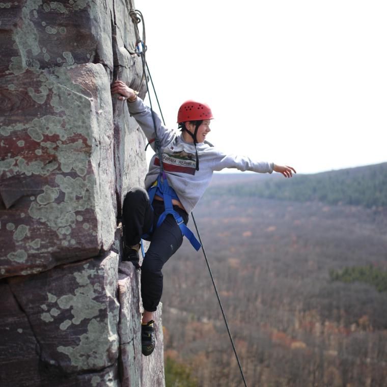 vanguard climbing a rock face