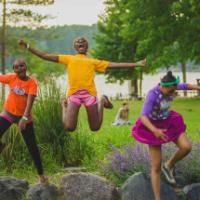 campers jumping off rocks at HoneyRock