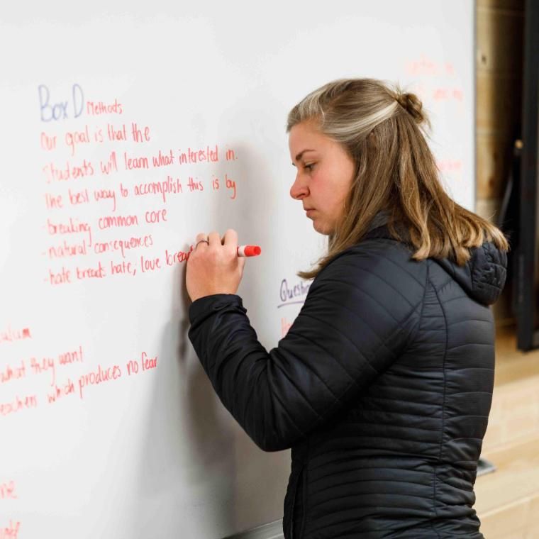 graduate student at whiteboard