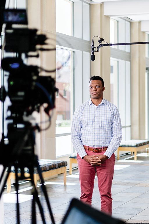 Wheaton made the historic decision to postpone Commencement ceremonies, but hosted virtual events to recognize the achievements of its graduates. Pictured is Dr. Theon HIll, Assistant Professor of Communication, being filmed for the virtual events.