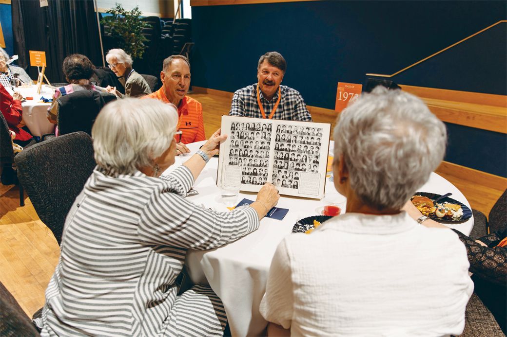 Reunion alumni search for classmates in old yearbooks.