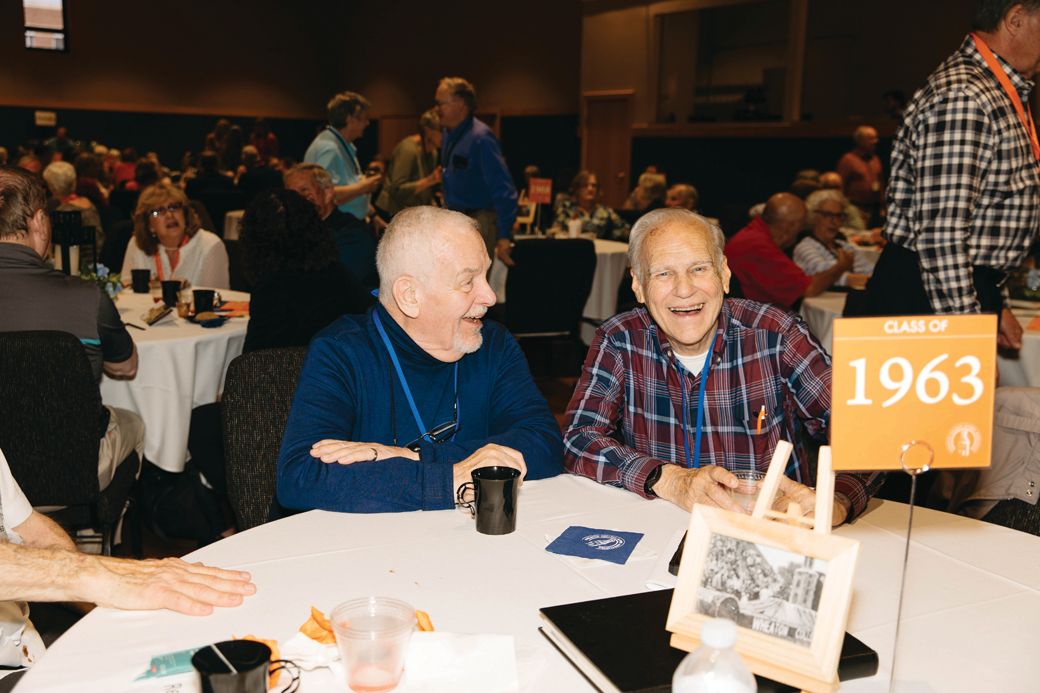 Two members of the Class of 1963 share a laugh during the Alumni Welcome Reception.